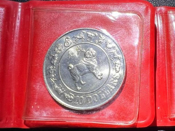 Singapore 10 Dollars Year of the Dog with red pouch